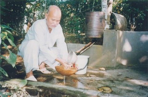 Thich Quang Do prepares his food in internal exile in Vu Doai village, Thai Binh province